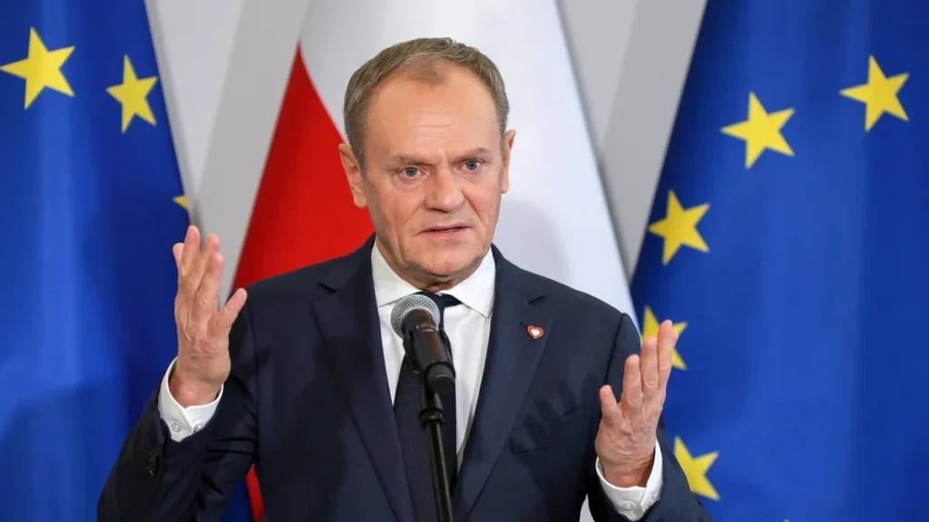 Newly appointed Polish Prime Minister Donald Tusk reacts after winning the vote of confidence for his government, in Parliament, in Warsaw.