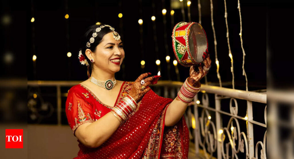 Why do women wear red clothes on Karwa Chauth?