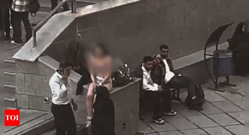 Iranian Woman: Iranian woman strips in protest over assault by security forces for improper hijab; arrested
